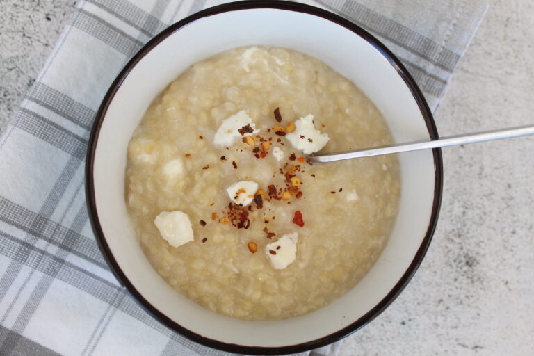 Trahana soup with feta cheese and toasted bread