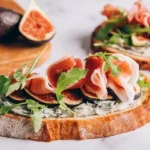 open-sandwich-with-prosciutto-and-figs-2022-11-24-17-11-51-utc-scaled_sthumb.webp